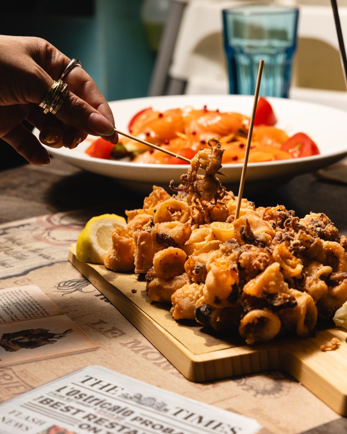 Fried calamari served on a wooden board