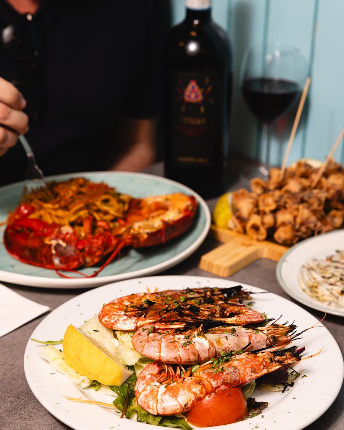 Grilled prawns, lobster and fried calamari shared at the table